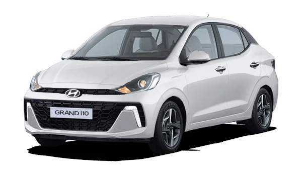 Hyundai Grand i10 Sedán color blanco: auto compacto con líneas limpias, faros delanteros alargados, parrilla negra y diseño funcional. Perfecto para ciudad con bajo consumo de combustible.